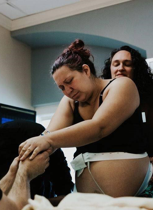 Woman recieving doula care during labor