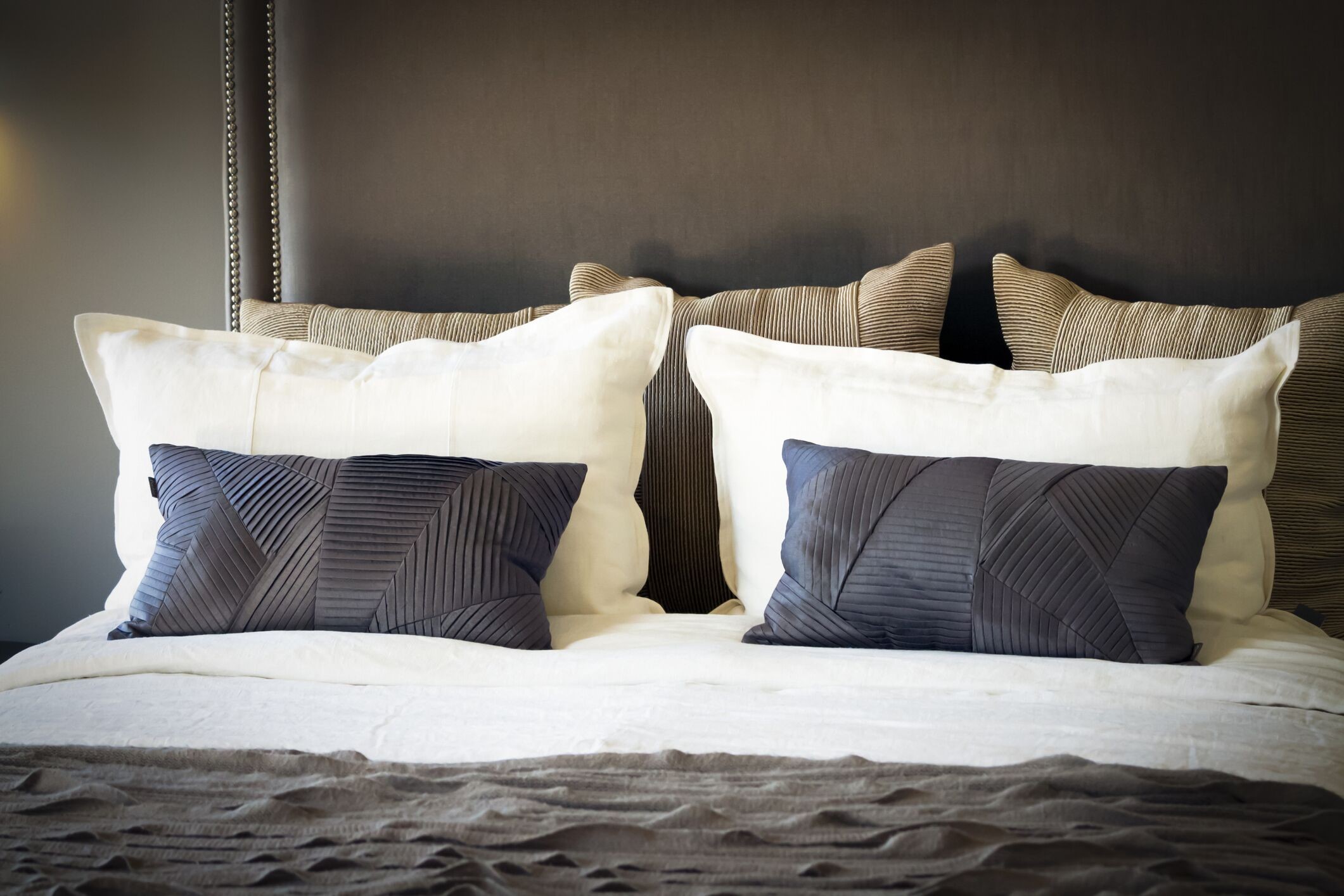 A big bed with large pillows